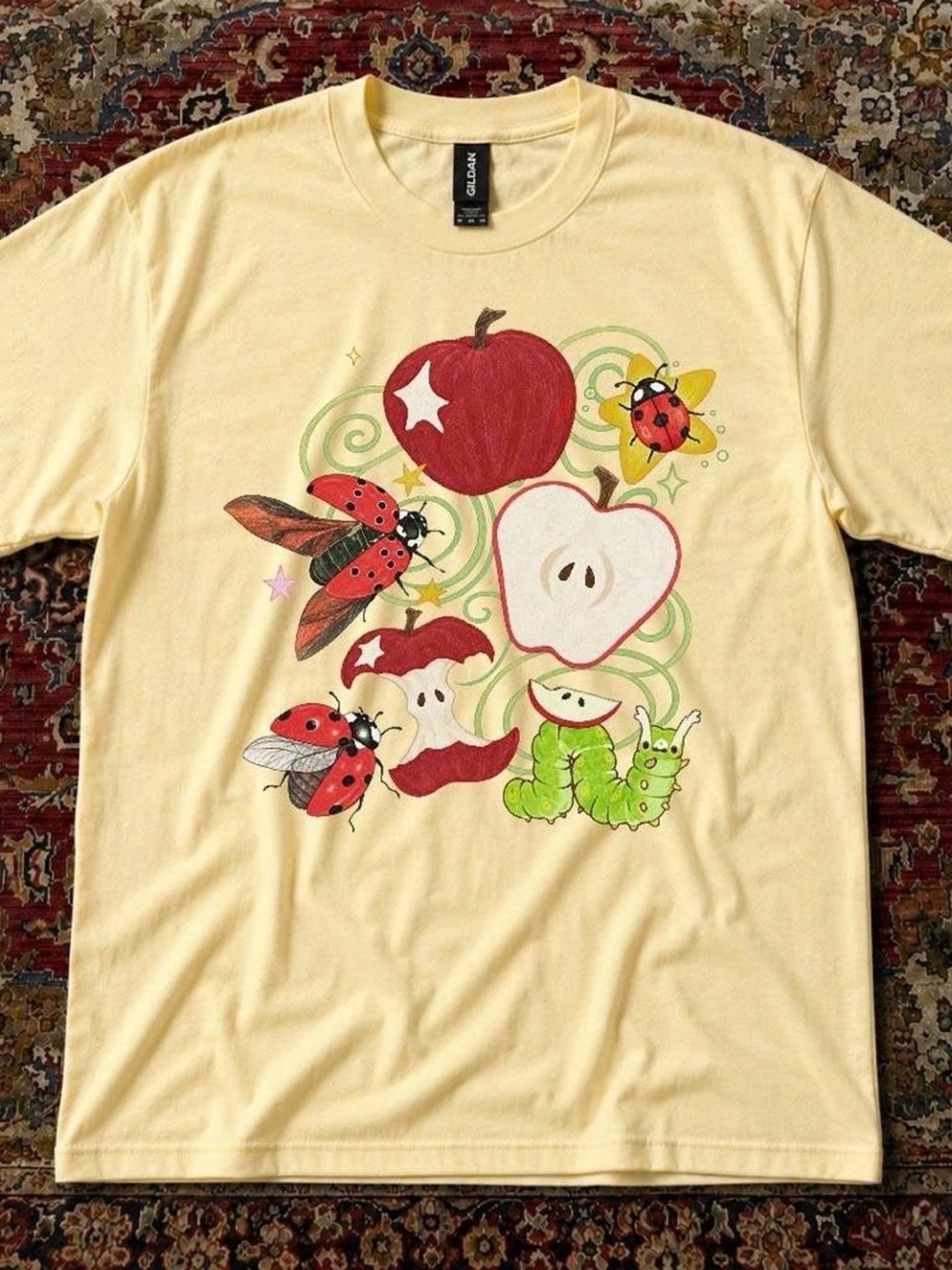 Gildan Pale Yellow Tee with Red Apple & Green Caterpillar Graphic